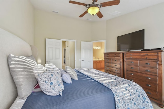 bedroom featuring ceiling fan and ensuite bath