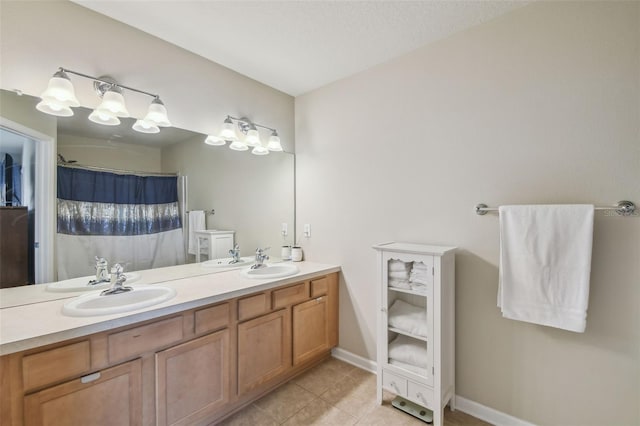 bathroom with tile patterned floors and vanity