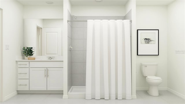 bathroom featuring a tile shower, vanity, tile patterned flooring, and toilet