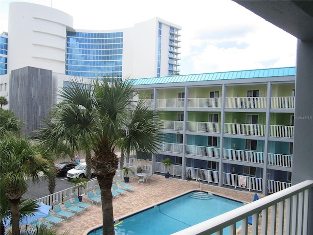 view of swimming pool with a patio