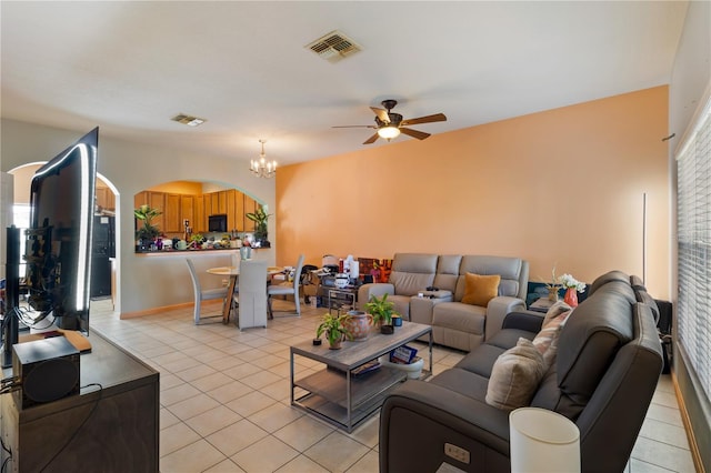 living room with light tile patterned floors, ceiling fan with notable chandelier, and visible vents