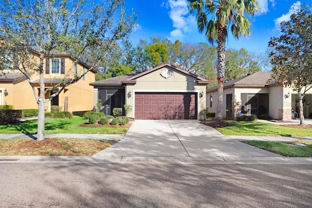 view of front of home featuring a garage and a front yard