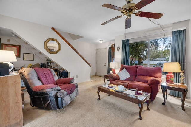 carpeted living room featuring ceiling fan