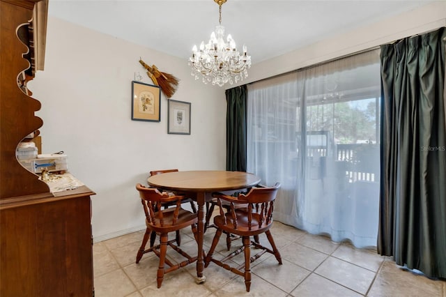 dining space featuring light tile patterned flooring and a notable chandelier