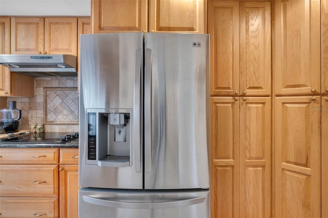 kitchen featuring black electric stovetop, decorative backsplash, dark stone counters, and stainless steel fridge with ice dispenser