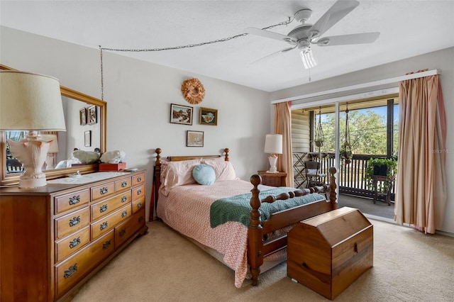 carpeted bedroom featuring a textured ceiling, access to outside, and ceiling fan