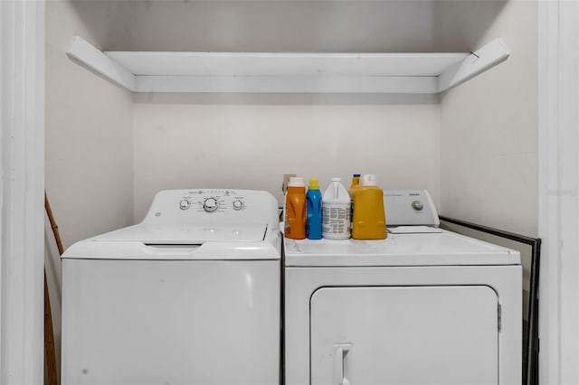 laundry room featuring separate washer and dryer