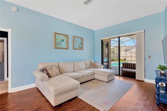 living room featuring dark wood-type flooring