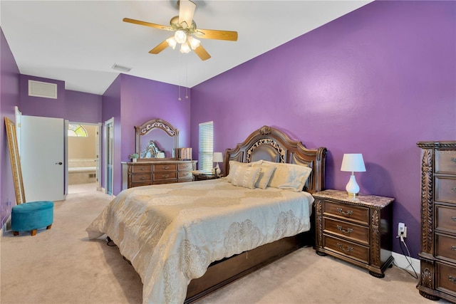 carpeted bedroom featuring connected bathroom and ceiling fan