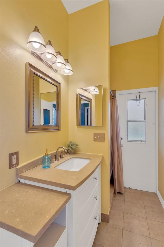 bathroom with tile patterned floors and vanity