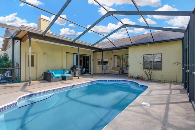 back of house with a patio, outdoor lounge area, and glass enclosure