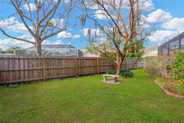 view of yard featuring glass enclosure