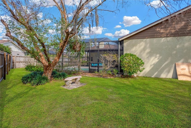 view of yard with glass enclosure