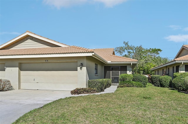 view of front facade with a garage and a front lawn