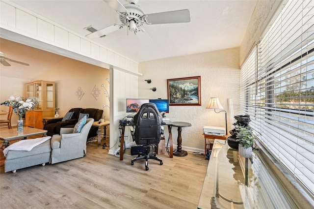 office area with ceiling fan and light hardwood / wood-style floors