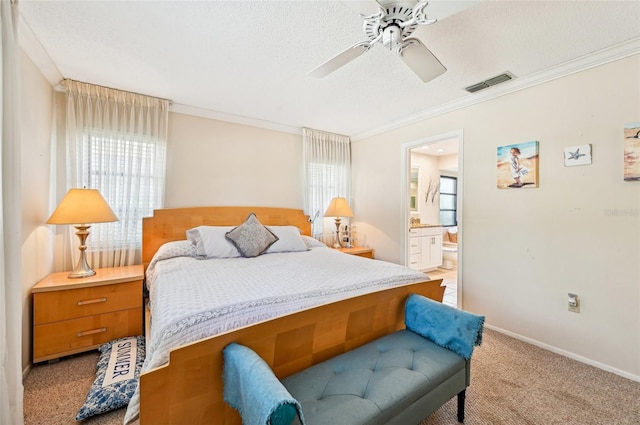 carpeted bedroom with ceiling fan, ornamental molding, multiple windows, and a textured ceiling