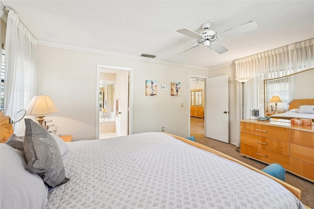 carpeted bedroom with ceiling fan, crown molding, a textured ceiling, and ensuite bathroom