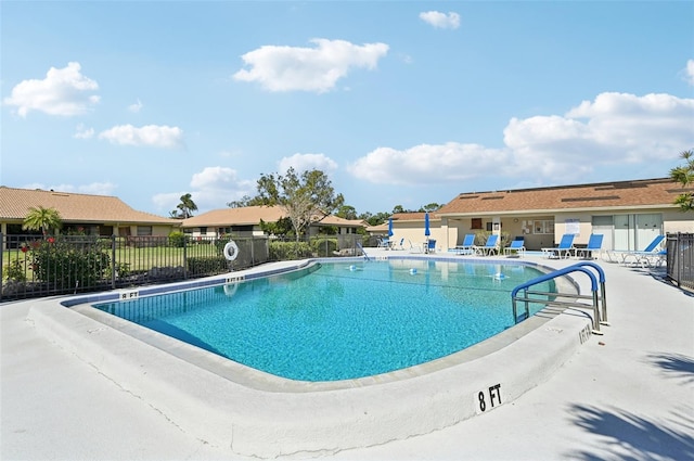 view of swimming pool featuring a patio area