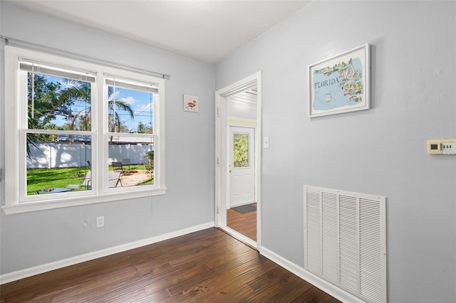 interior space with dark hardwood / wood-style flooring