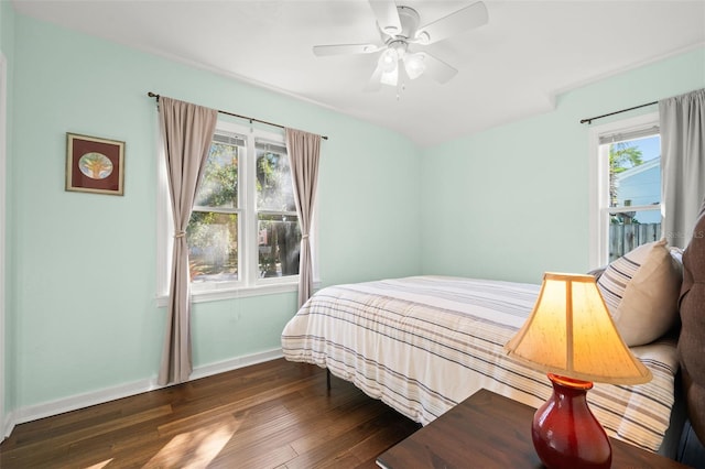 bedroom featuring dark hardwood / wood-style floors and ceiling fan