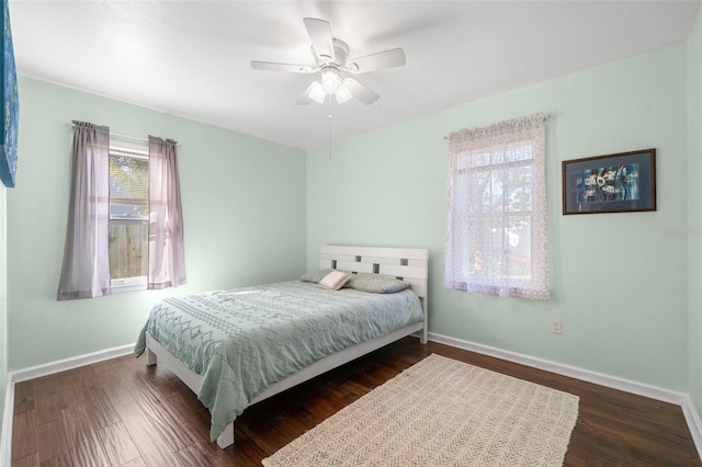 bedroom featuring dark wood-type flooring and ceiling fan