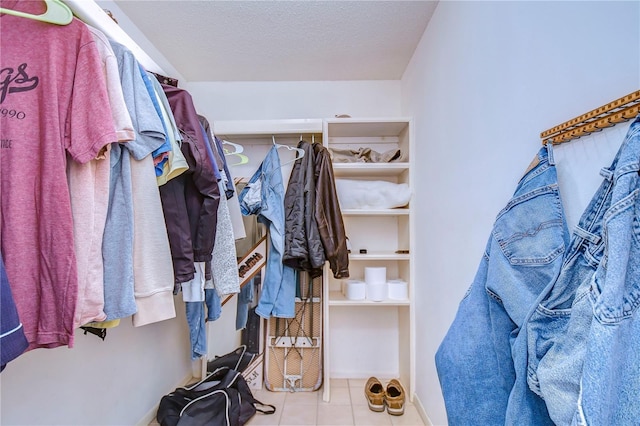 spacious closet featuring light tile patterned floors