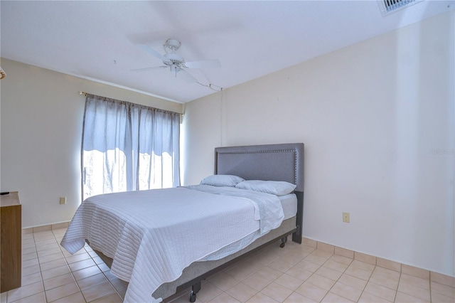 bedroom featuring light tile patterned floors and ceiling fan