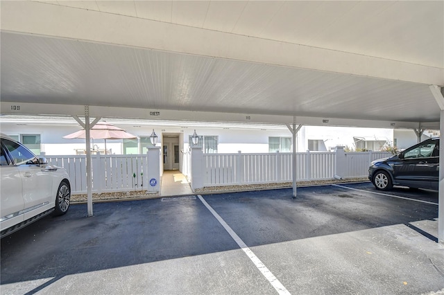 view of parking / parking lot with a carport