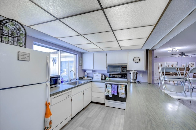 kitchen with a paneled ceiling, sink, white cabinets, ceiling fan, and white appliances