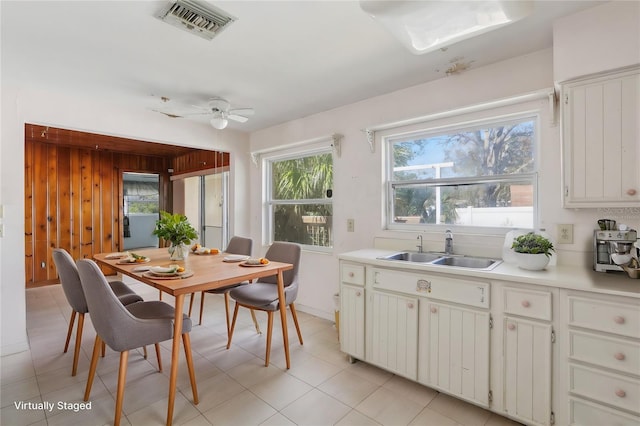 dining room with sink and ceiling fan