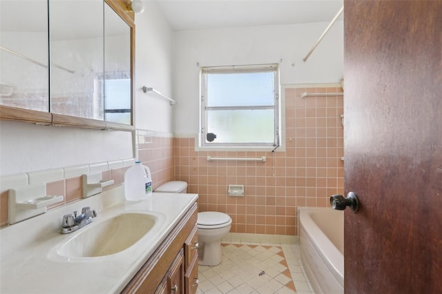 full bathroom with tile walls, tile patterned flooring, vanity,  shower combination, and toilet