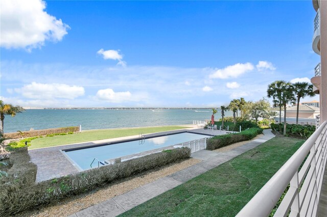 4951 Bacopa Ln S Unit 103, Saint Petersburg, FL 33715 - view of swimming pool with a lawn and a water view