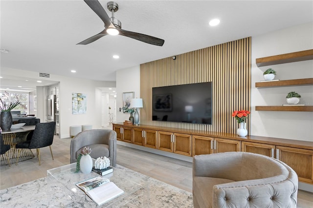 4951 Bacopa Ln S Unit 103, Saint Petersburg, FL 33715 - living room with ceiling fan and light wood-type flooring