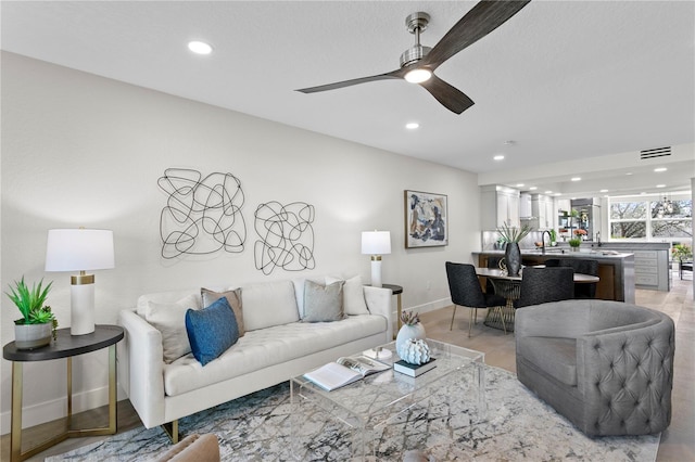 4951 Bacopa Ln S Unit 103, Saint Petersburg, FL 33715 - living room featuring ceiling fan