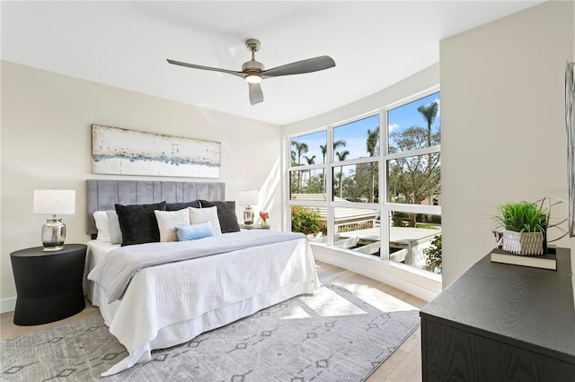 4951 Bacopa Ln S Unit 103, Saint Petersburg, FL 33715 - bedroom featuring ceiling fan and light wood-type flooring