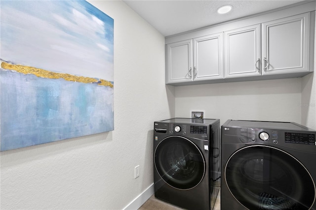 4951 Bacopa Ln S Unit 103, Saint Petersburg, FL 33715 - laundry area featuring cabinets and washing machine and clothes dryer