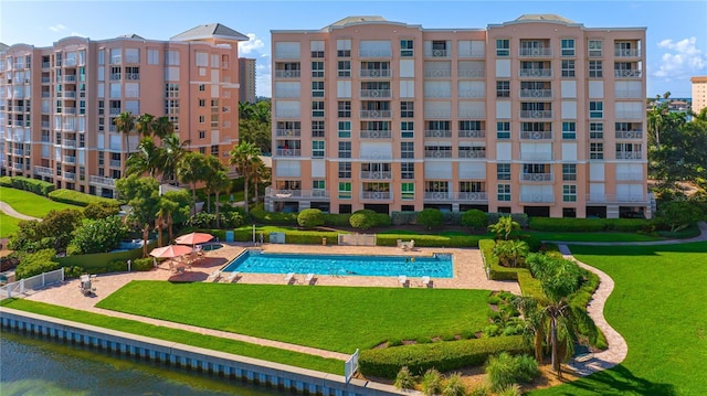 4951 Bacopa Ln S Unit 103, Saint Petersburg, FL 33715 - view of pool with a lawn and a water view