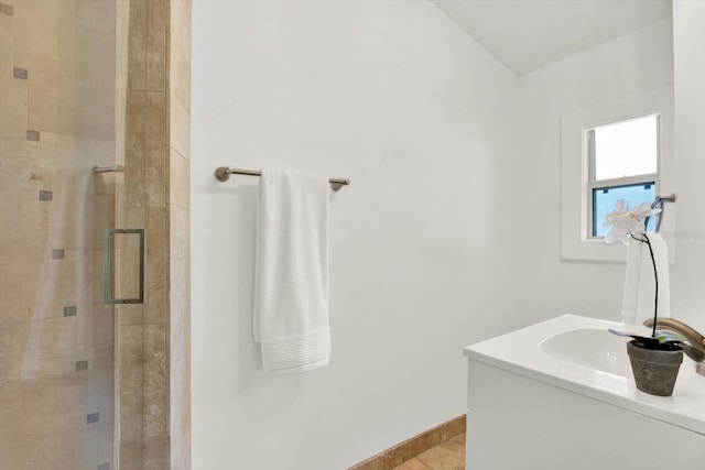 bathroom with sink, tile patterned flooring, and a shower with door