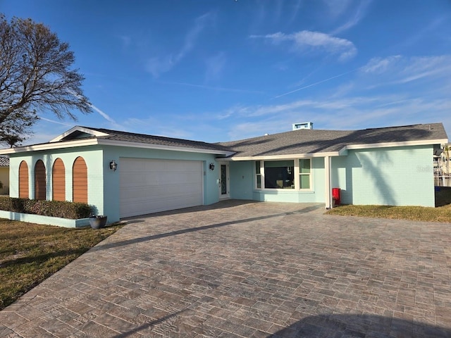 single story home featuring a garage