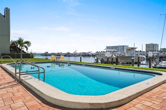 view of pool with a water view