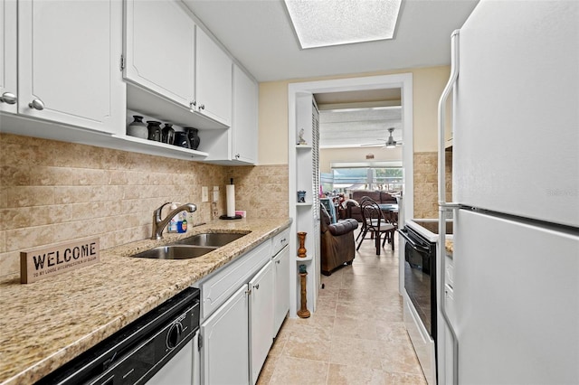 kitchen with sink, white refrigerator, dishwasher, electric stove, and white cabinets