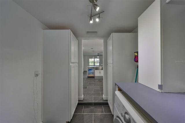 bathroom with tile patterned flooring and rail lighting