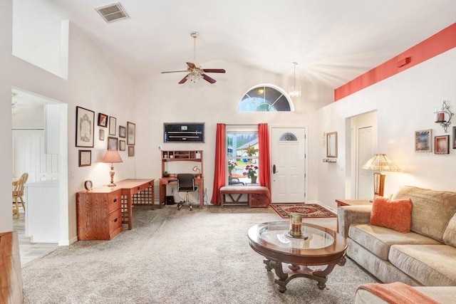 carpeted living area featuring high vaulted ceiling, ceiling fan, and visible vents