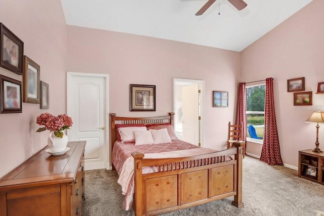 bedroom with light carpet, ceiling fan, and vaulted ceiling