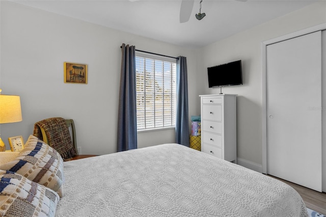 bedroom with ceiling fan and hardwood / wood-style floors