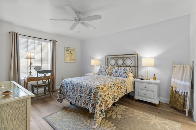 bedroom featuring hardwood / wood-style flooring and ceiling fan