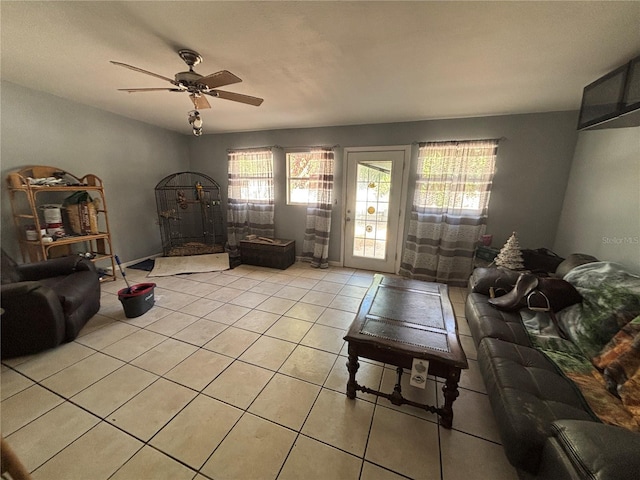 living room with ceiling fan and light tile patterned floors