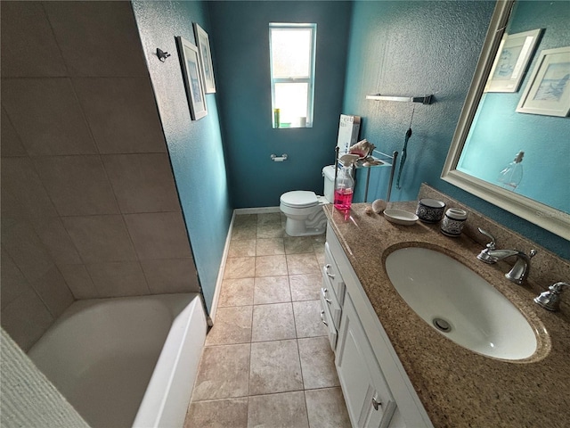 bathroom featuring vanity, tile patterned floors, and toilet