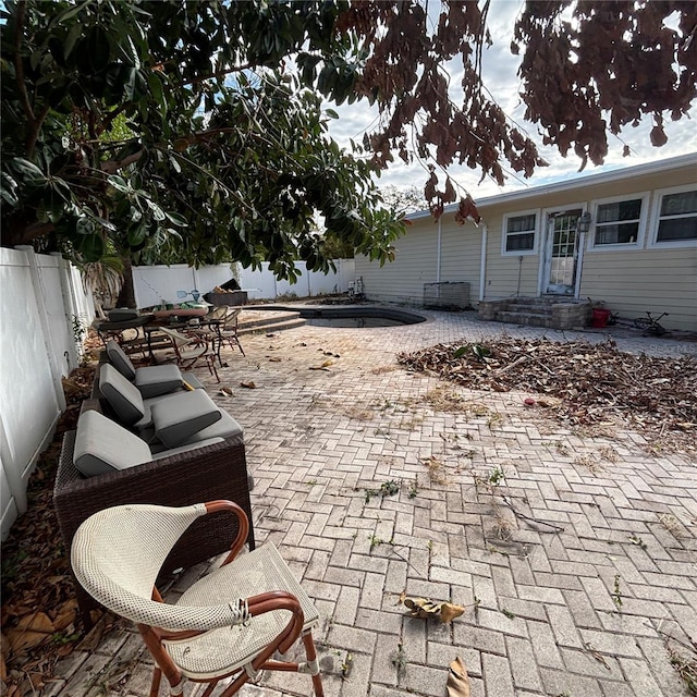 view of patio / terrace featuring a fenced in pool