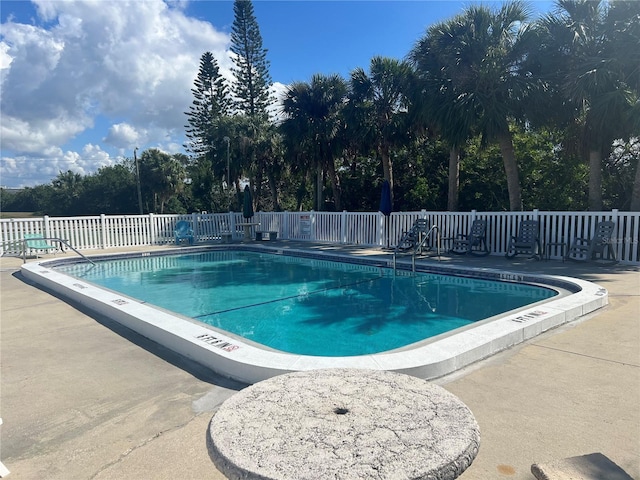 view of swimming pool featuring a patio